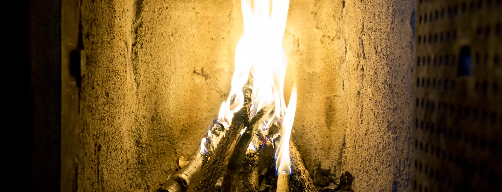 First fire burning in the repaired fireplace