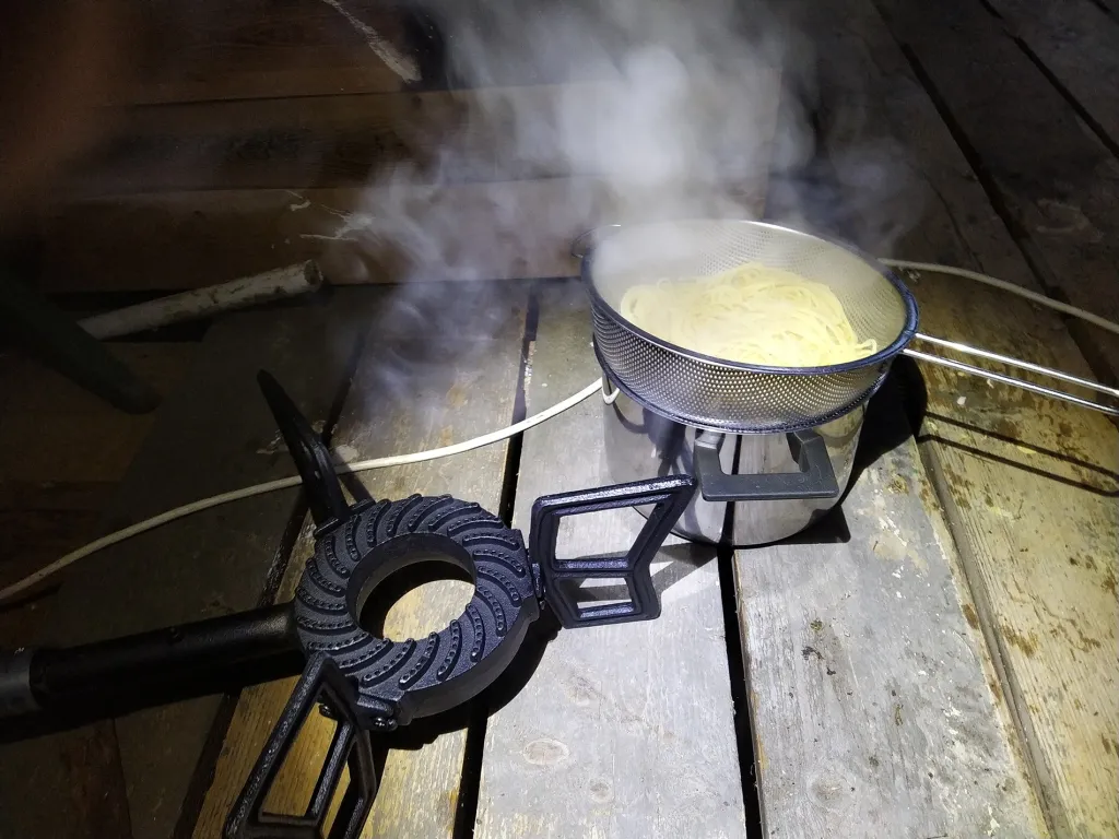 Cooking spaghetti on a biogas stove