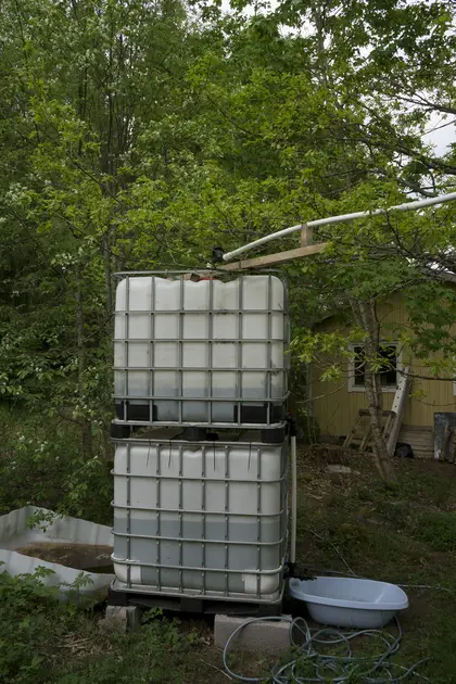 IBC stacked front side of the house