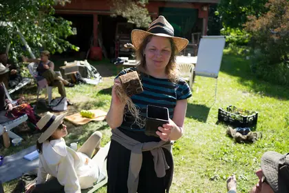 Participant holding a plant container
