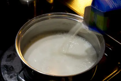 Pouring milk into a pot