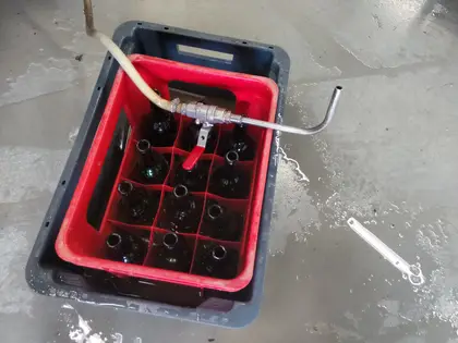 the empty bottles sitting in a warm water baths